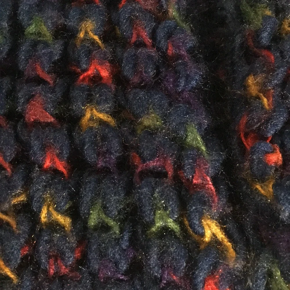 Blue knitted look infinity scarf with touches of red green gold